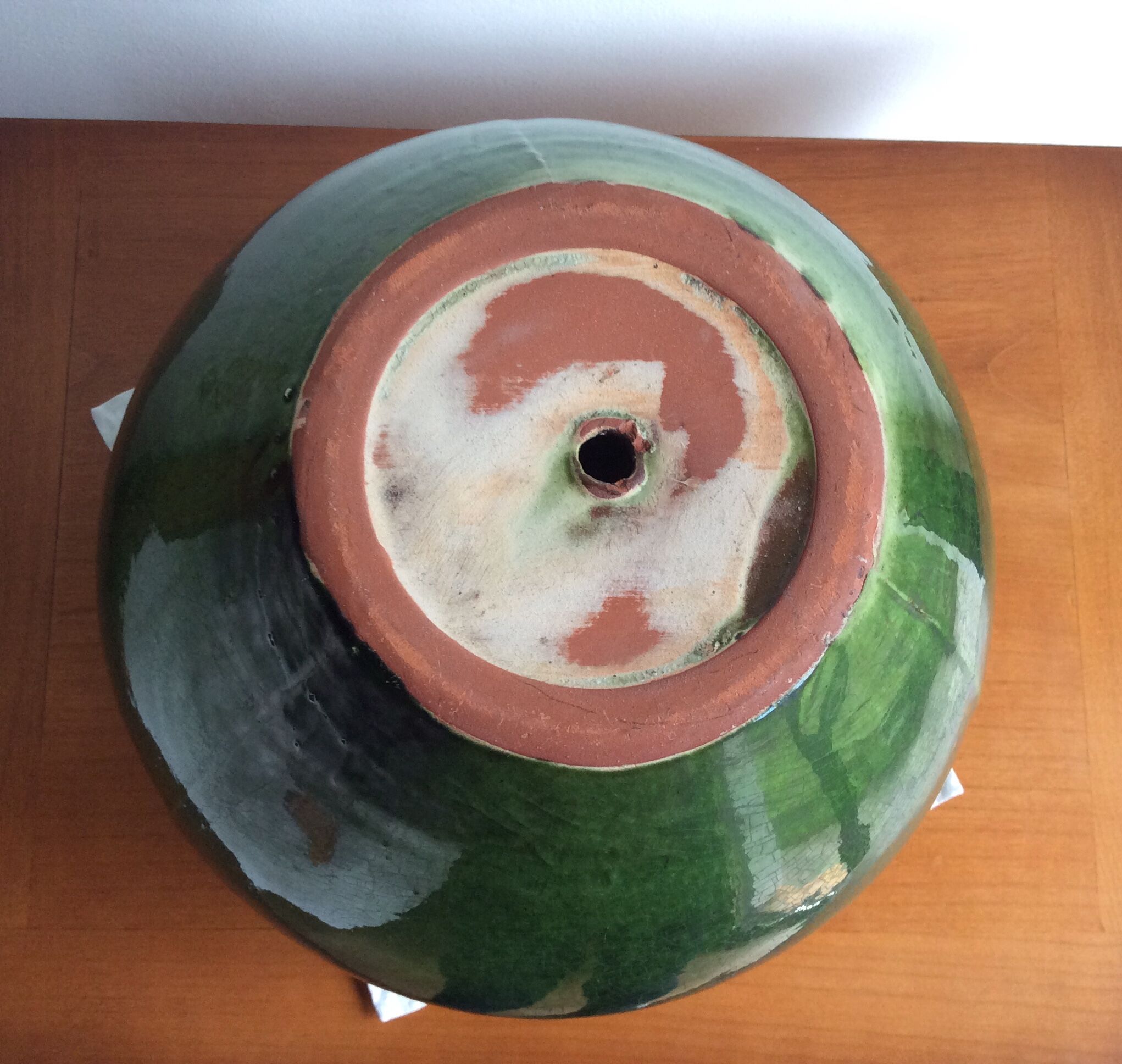 Old terracotta pot enamelled ball shape