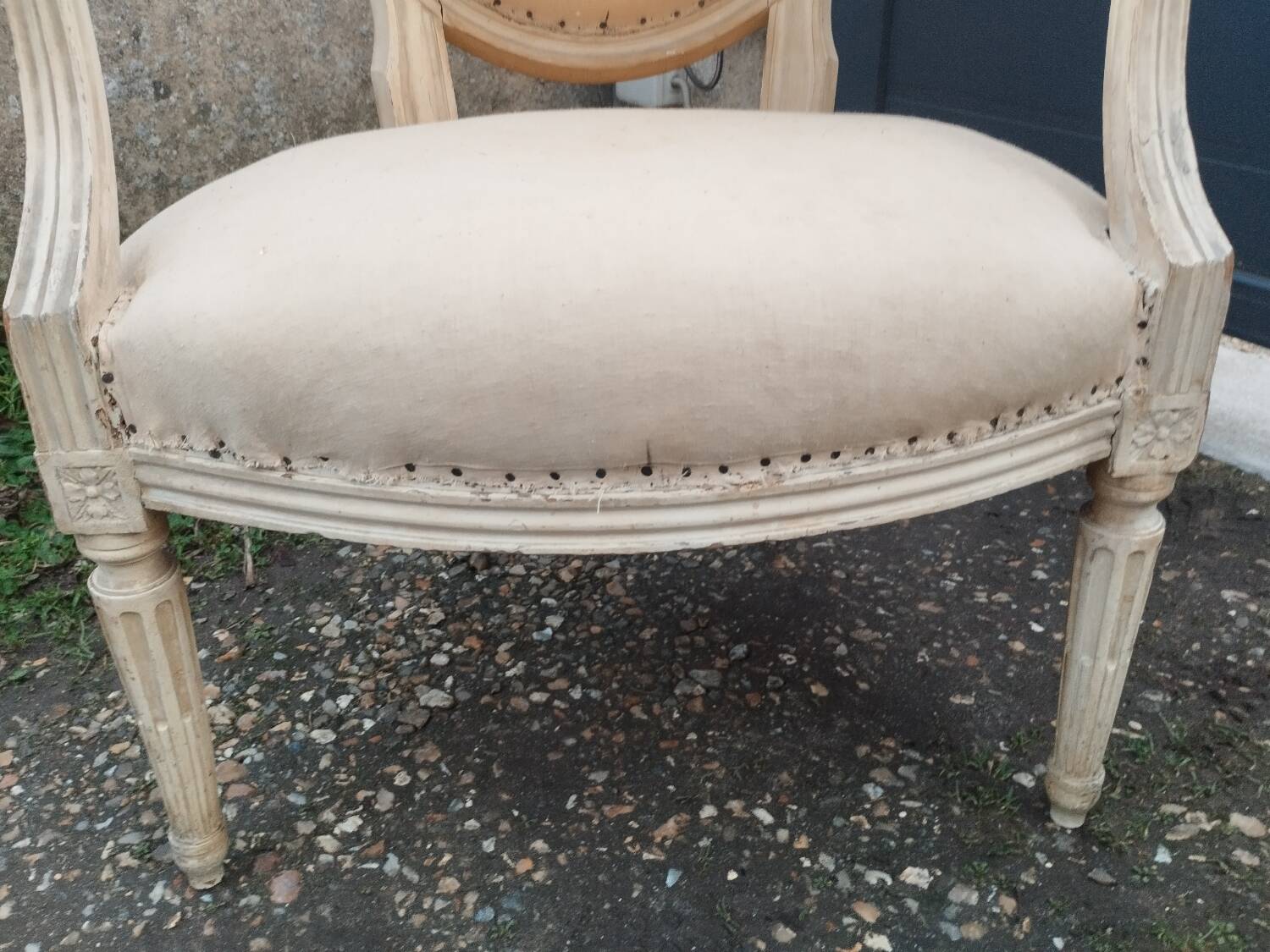 Antique armchair in Louis XVI style from the late 19th century.