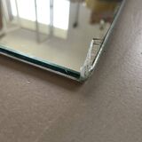 Miroir biseauté en pied ancien
