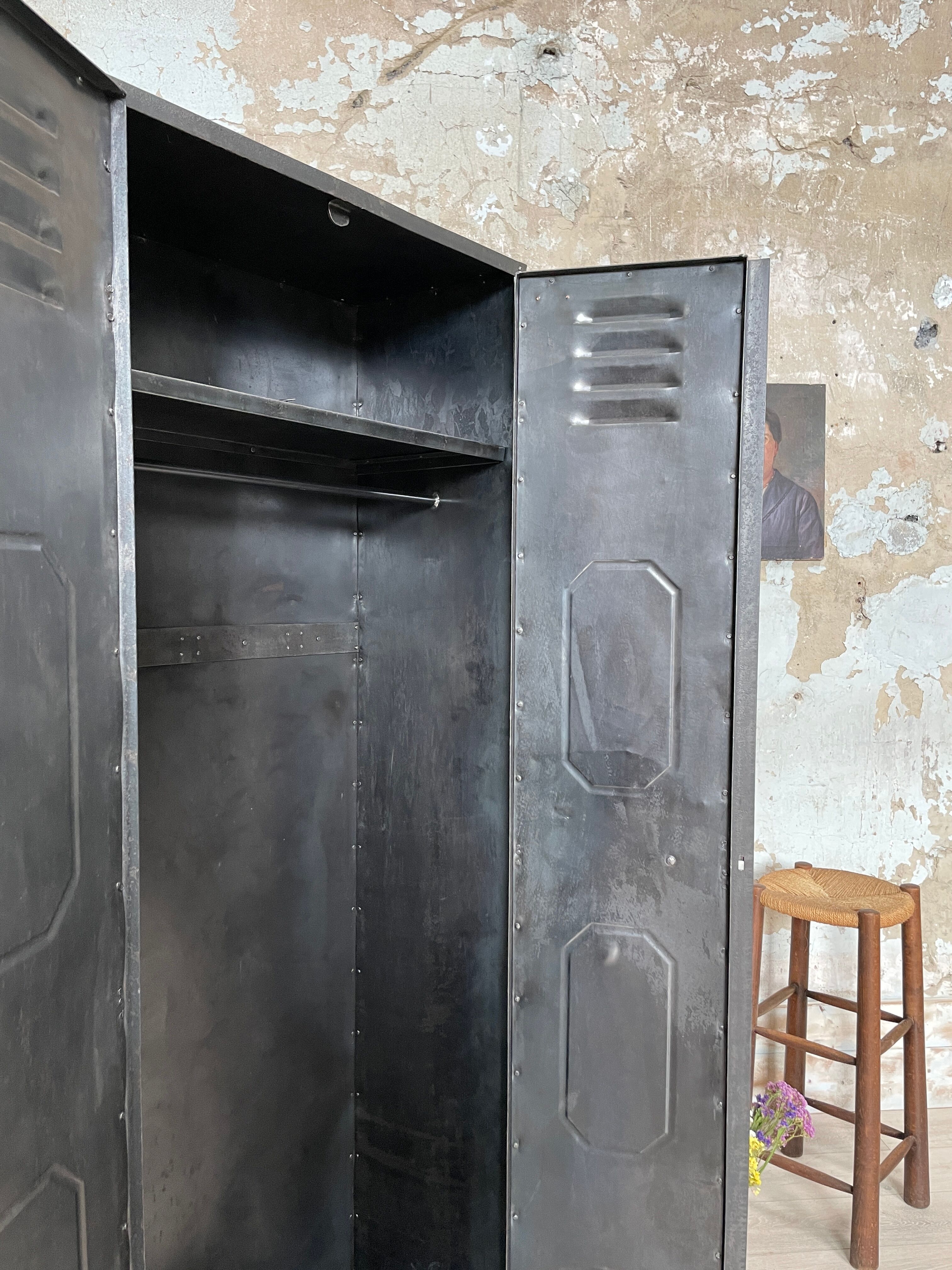 Industrial locker room in raw metal, circa 1930.
