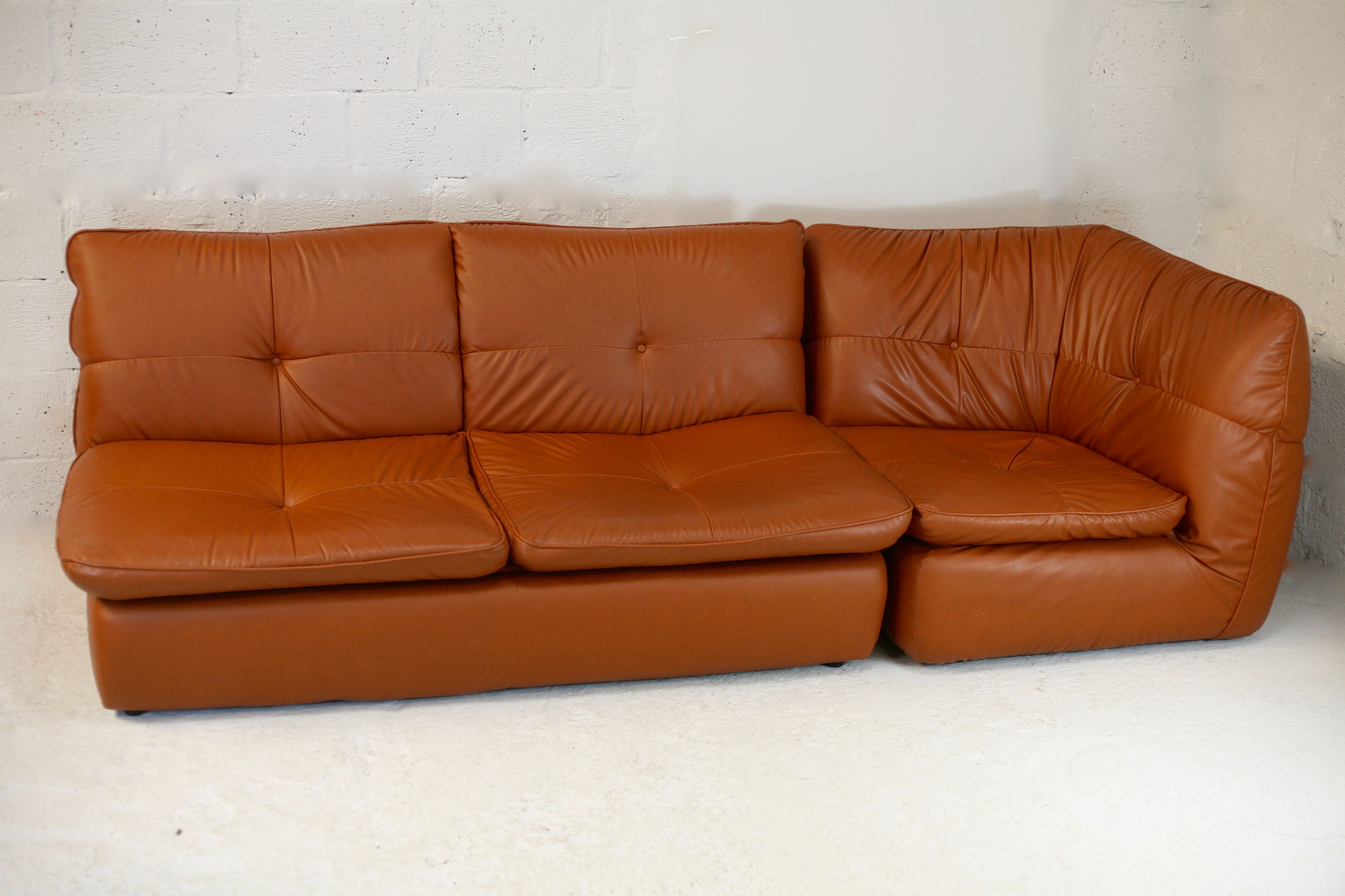 Imitation leather sofa "caramel". Convertible. France, circa 1990