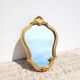 Petit miroir doré 22x32cm fronton coquille