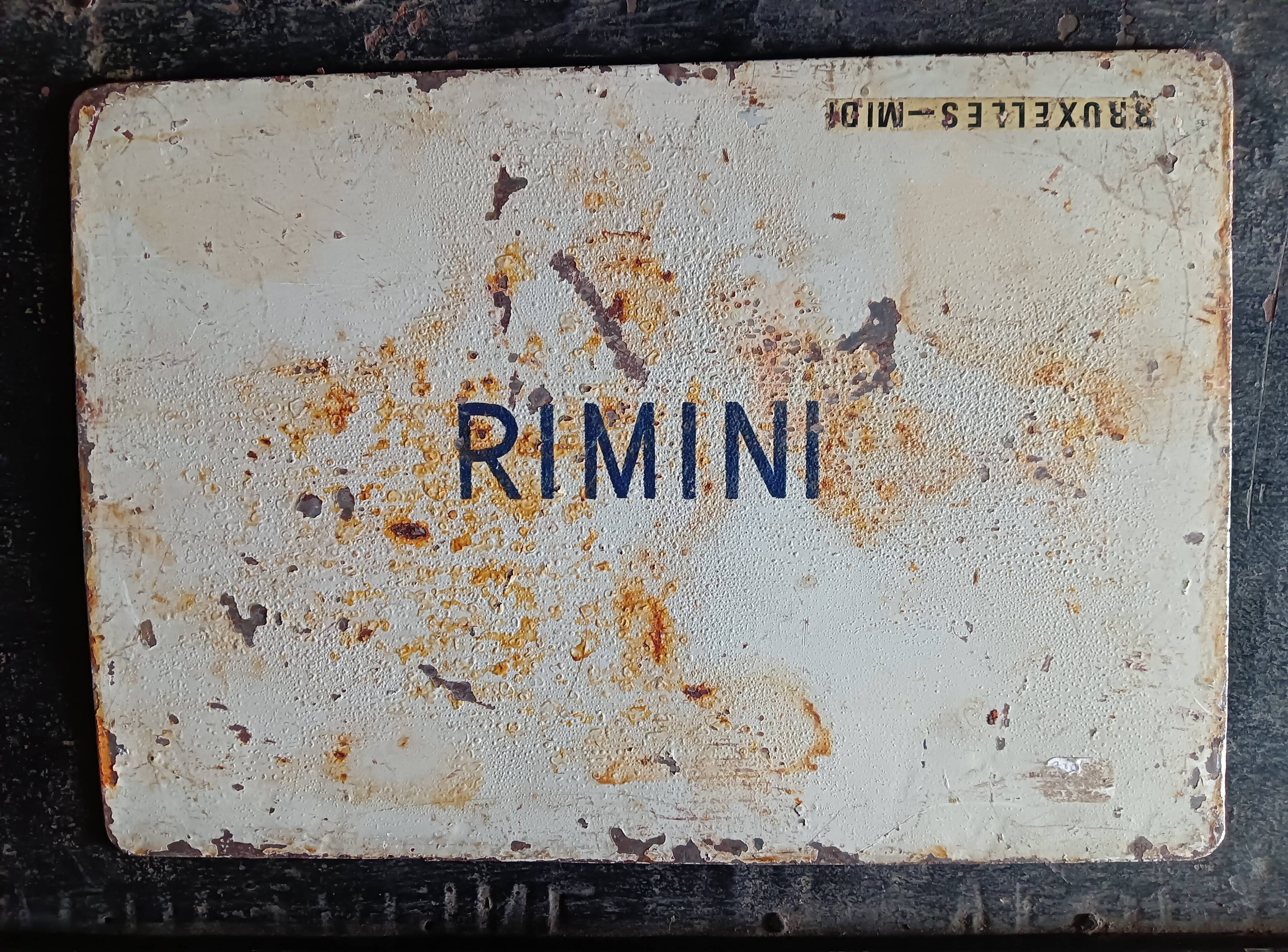 Destination plate of the "sncb" railway brussels - brussel and on the other side rimini,