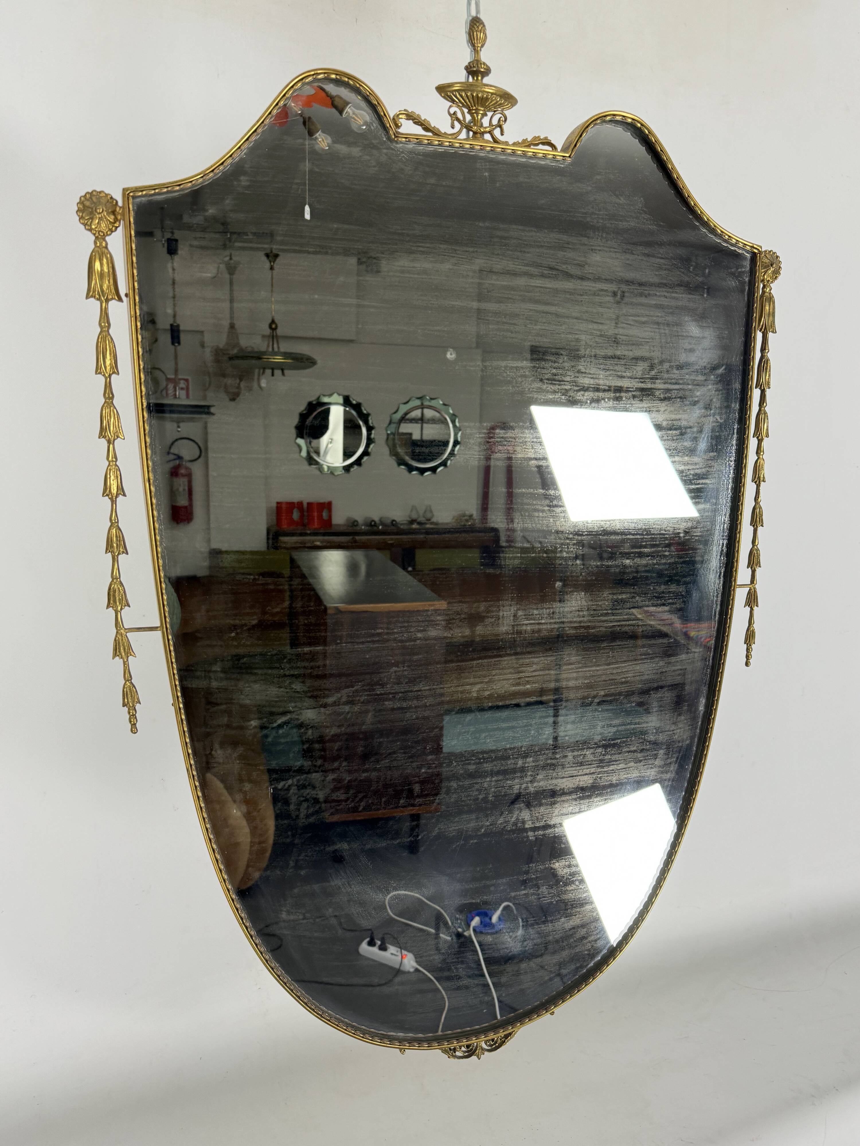 Mid-century Italian mirror in brass. Italy 1950s
