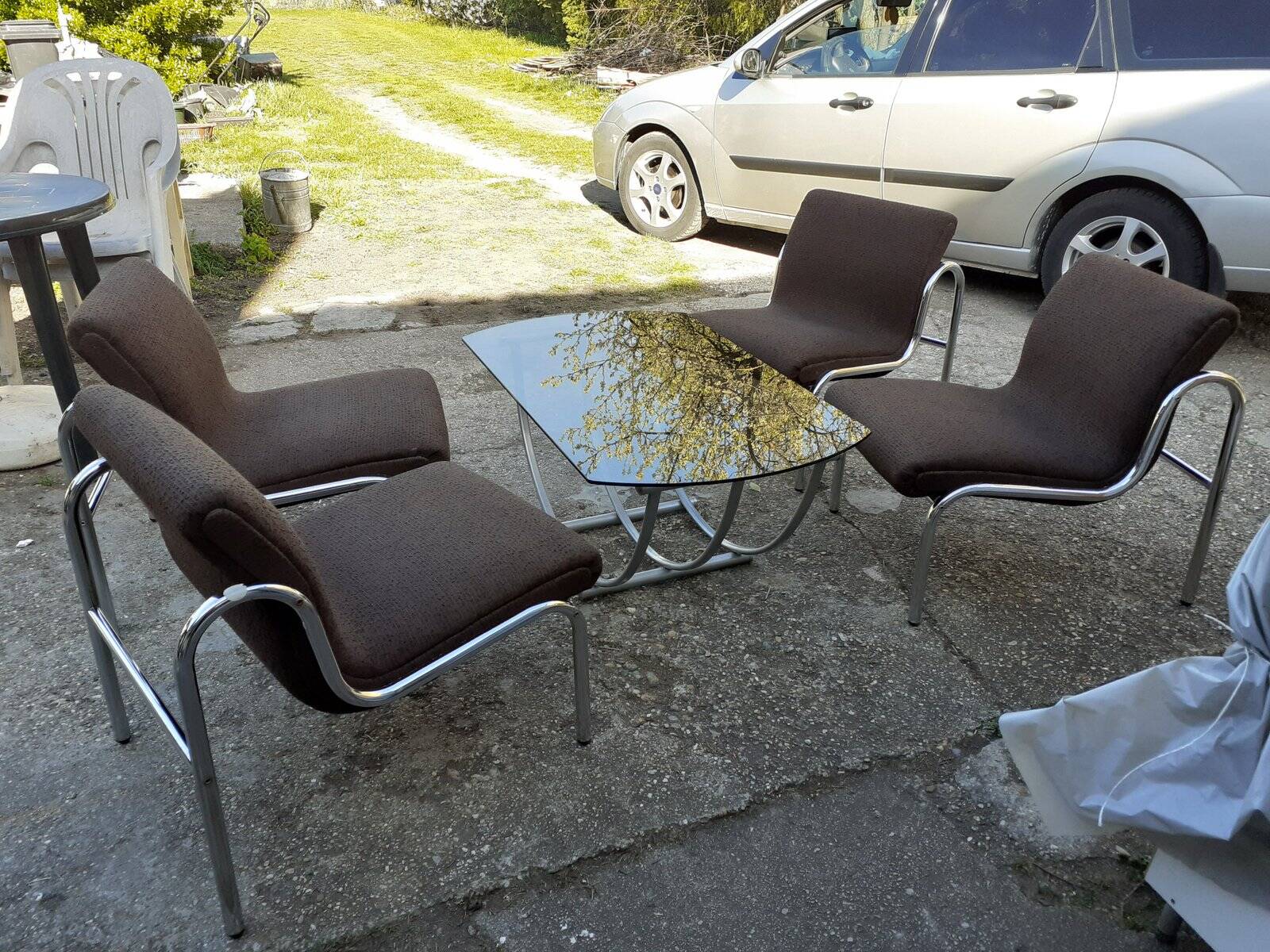 Table and 4 chairs in chrome metal with brown fabric and wood, Hungarian design from the 1960s.