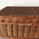 Wicker suitcase to store toys.