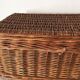 Wicker suitcase to store toys.