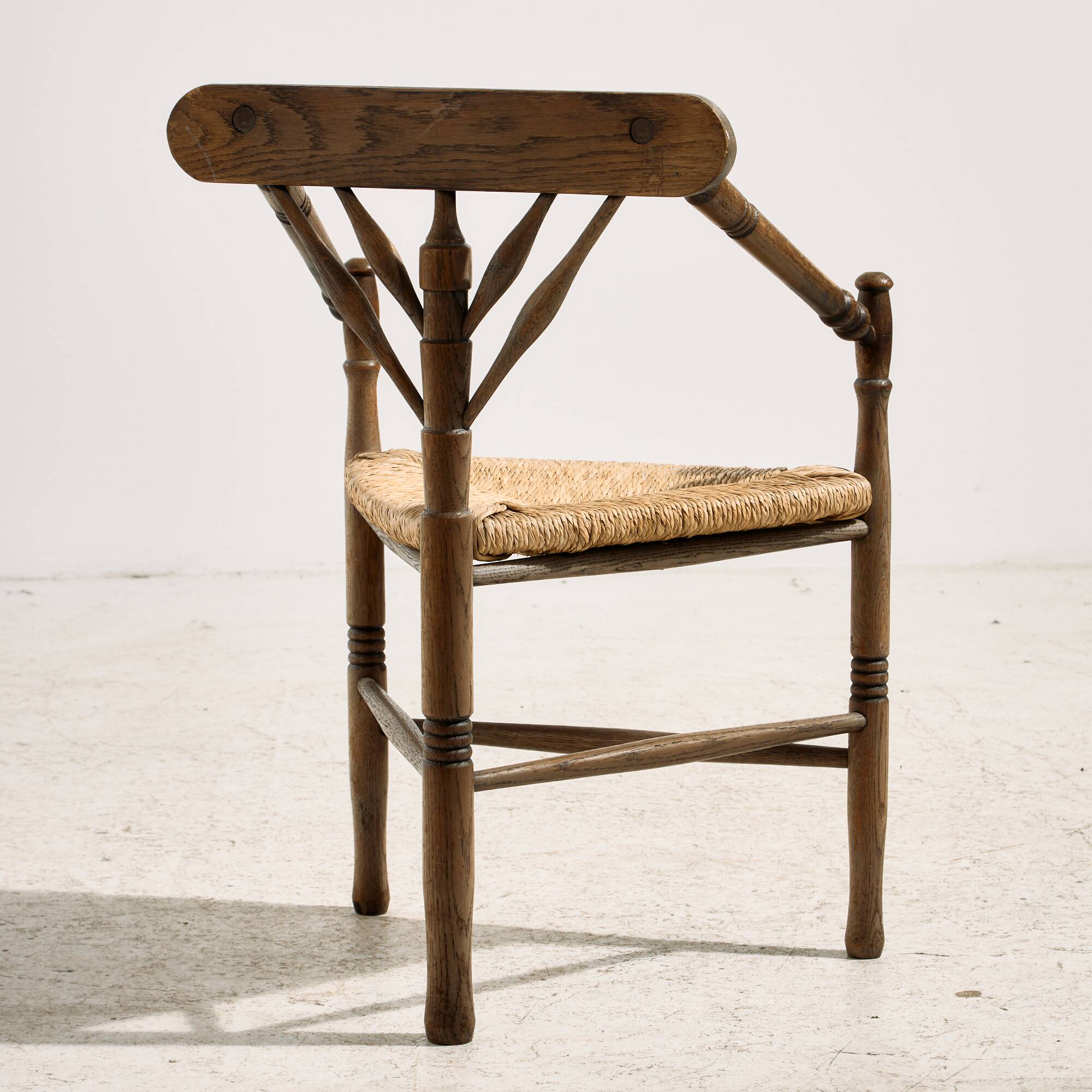 Oak armchair with three legs