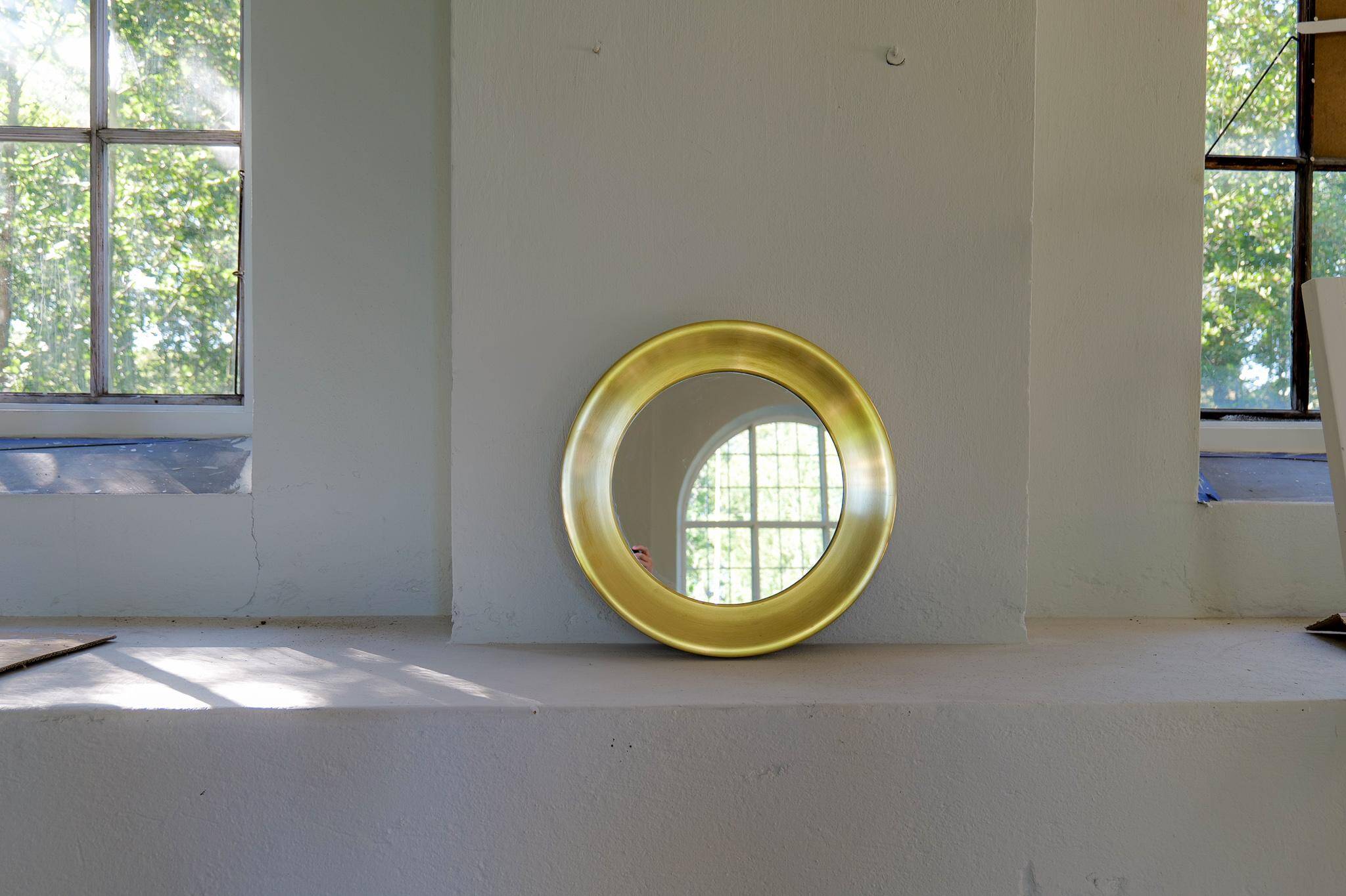 Modern round brass mirror from the mid-century by Glasmäster in Markaryd, Sweden, 1960s.