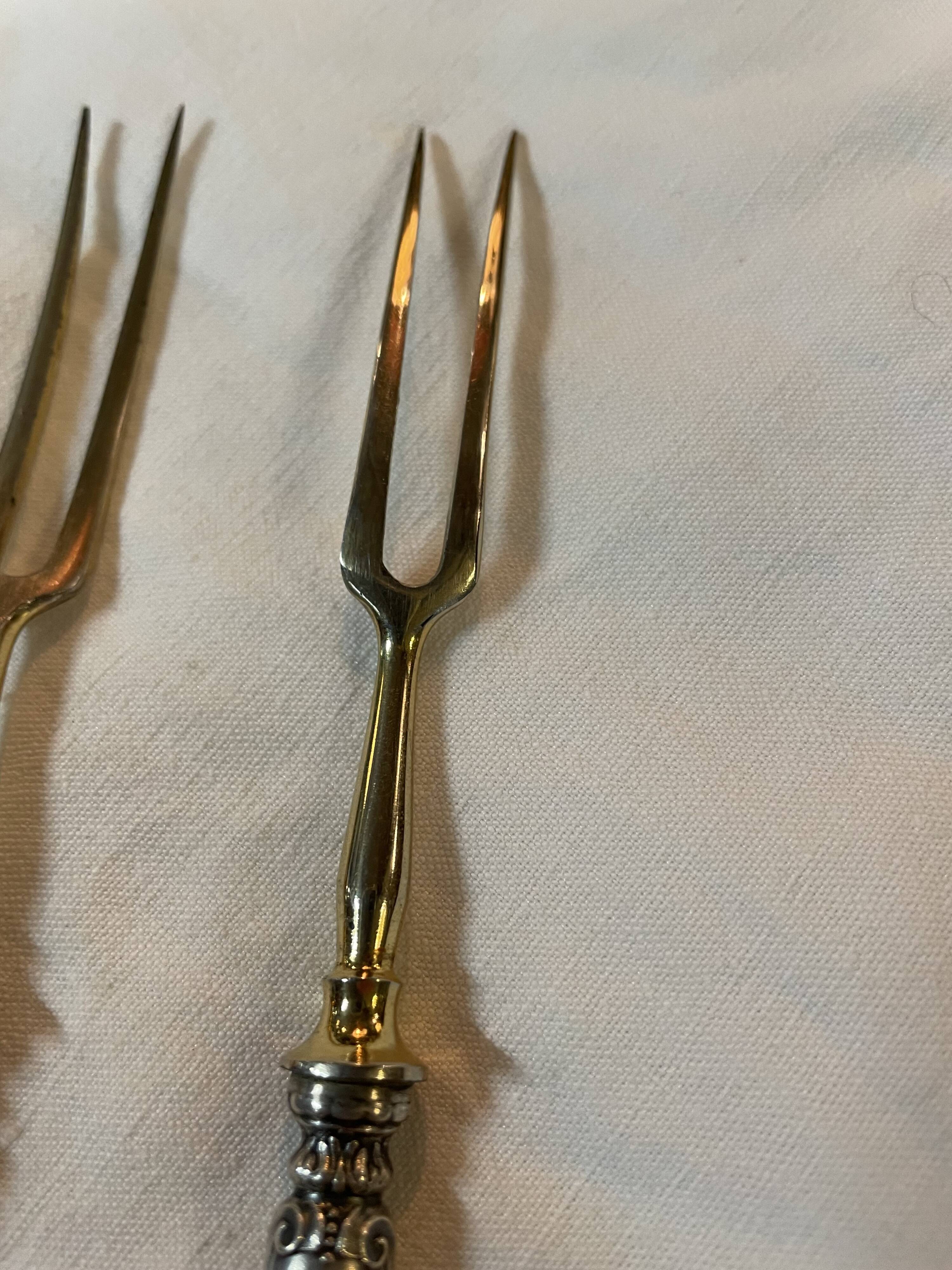 Paire de fourchettes à charcuterie en argent