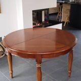 Round cherry wood table with extensions