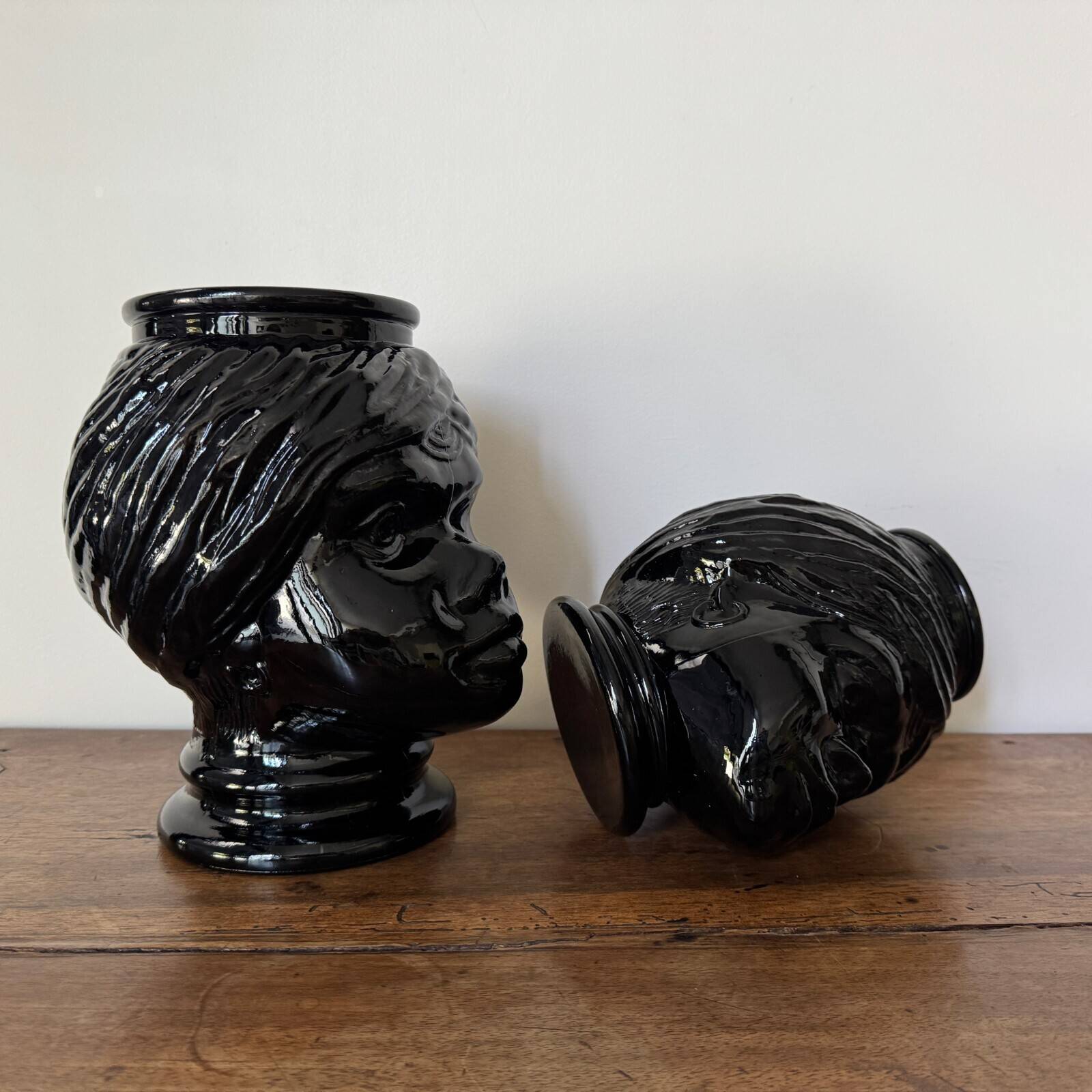 2 glass heads representing Moors