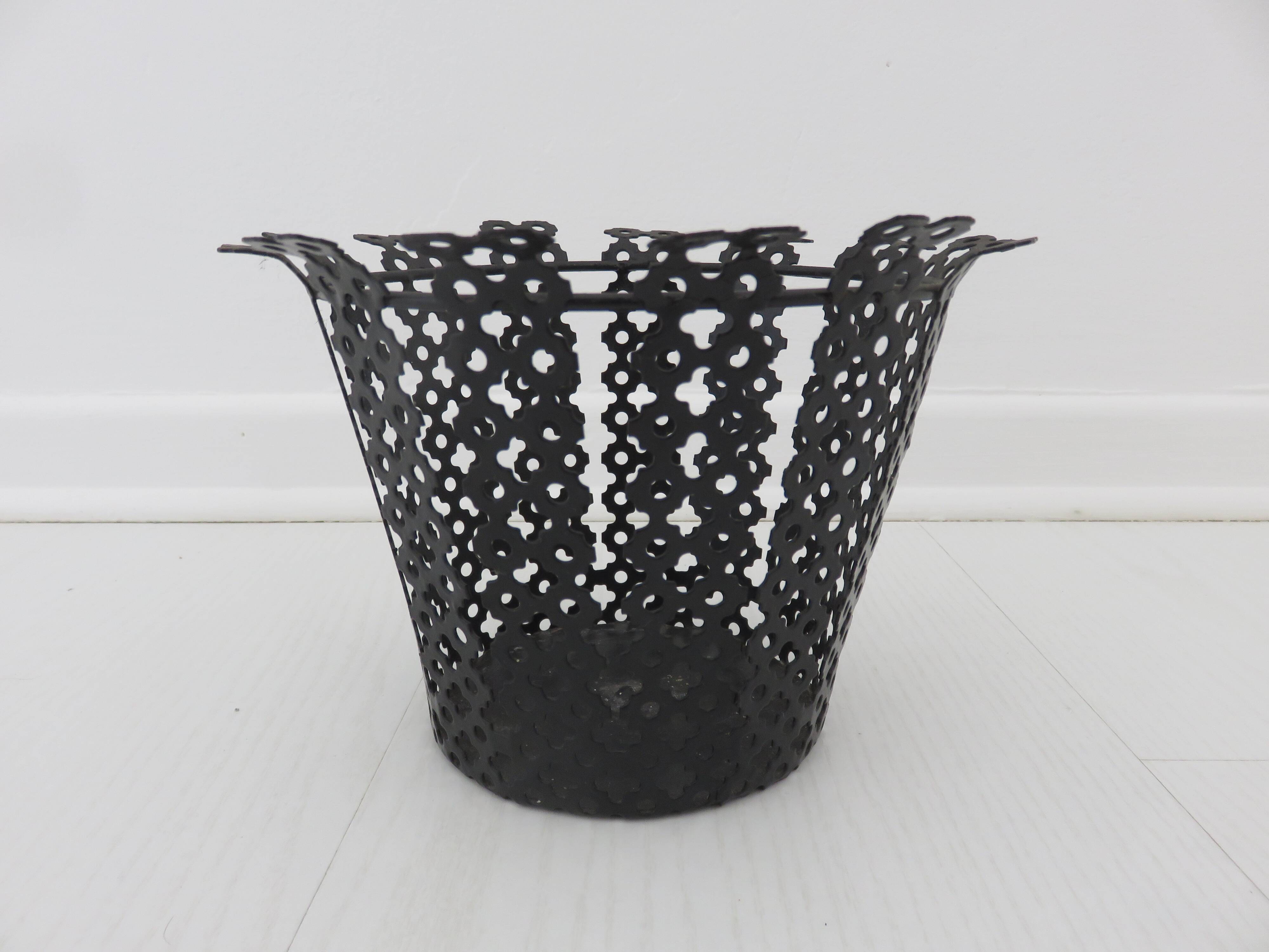 Perforated black metal cachepot from the 1950s and 1960s.