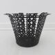 Perforated black metal cachepot from the 1950s and 1960s.