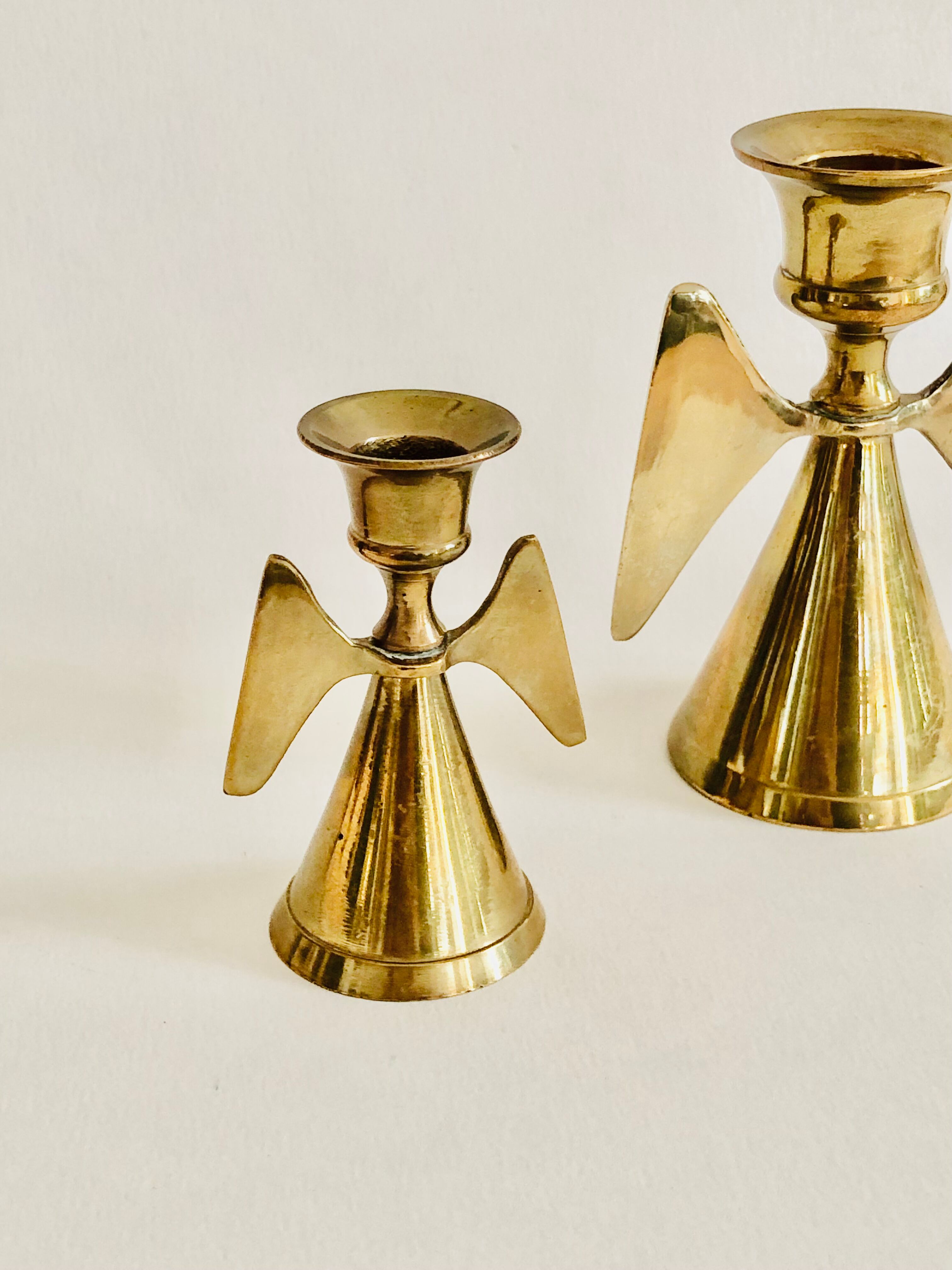 Duo of brass angel candle holders