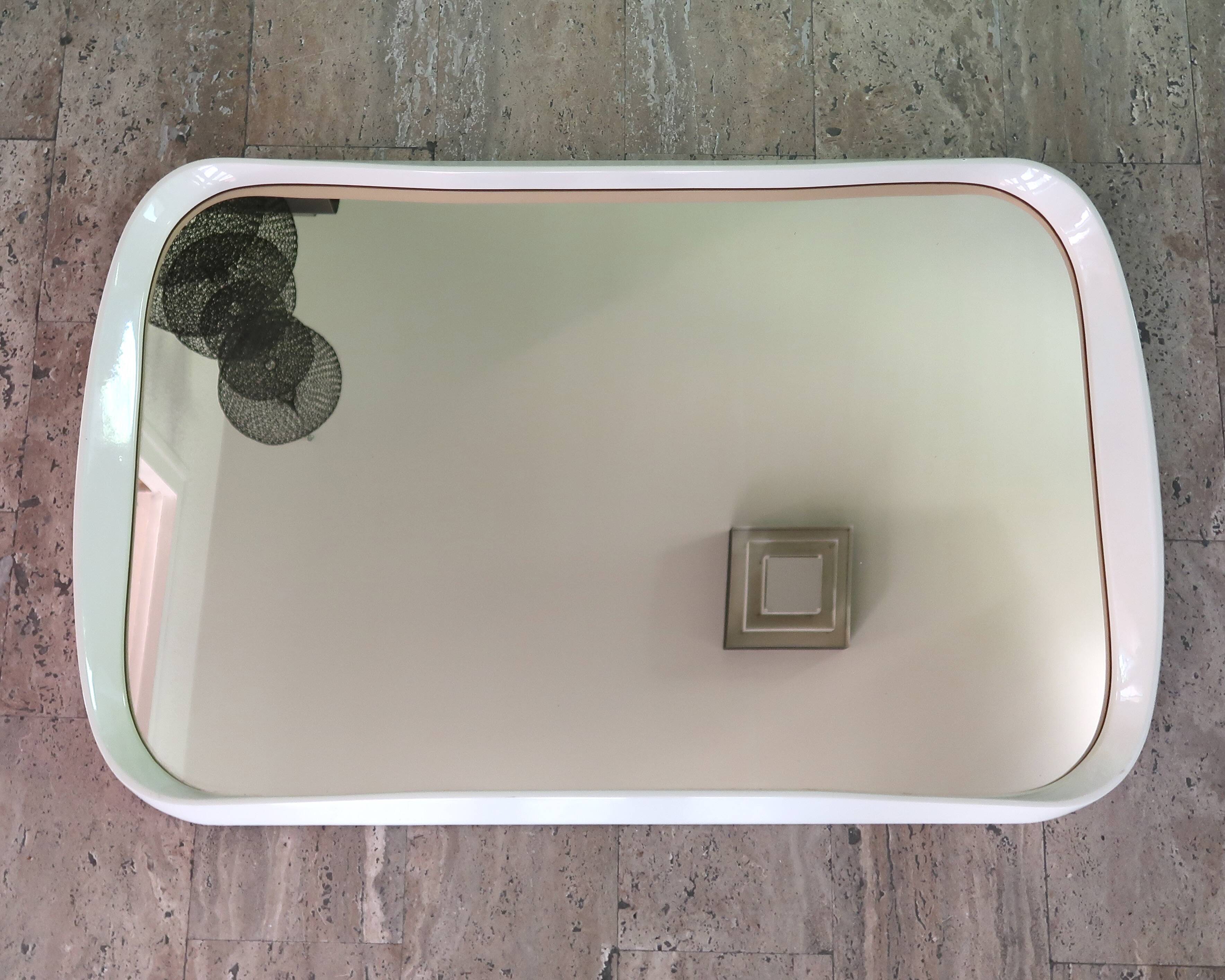 Rectangular mirror, horizontal or vertical, in white lacquered wood, 1970s.