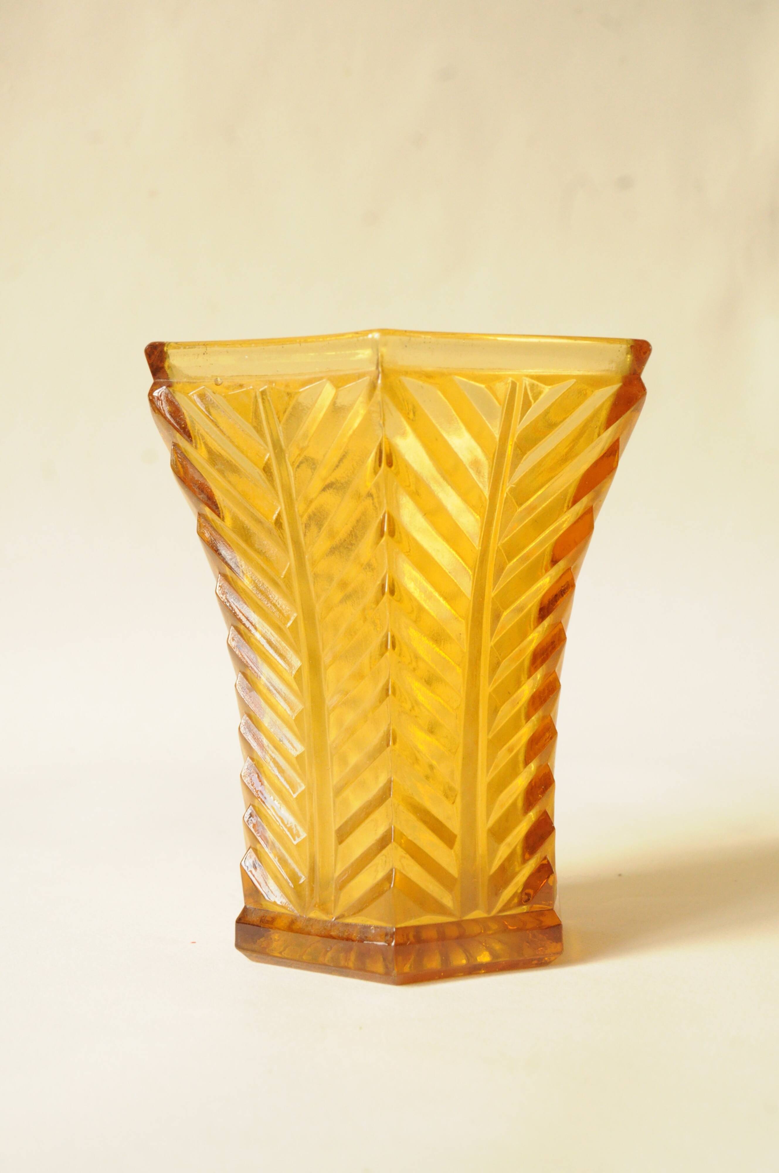 Vintage Art Deco vase in amber yellow cut glass with geometric design.