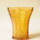 Vintage Art Deco vase in amber yellow cut glass with geometric design.
