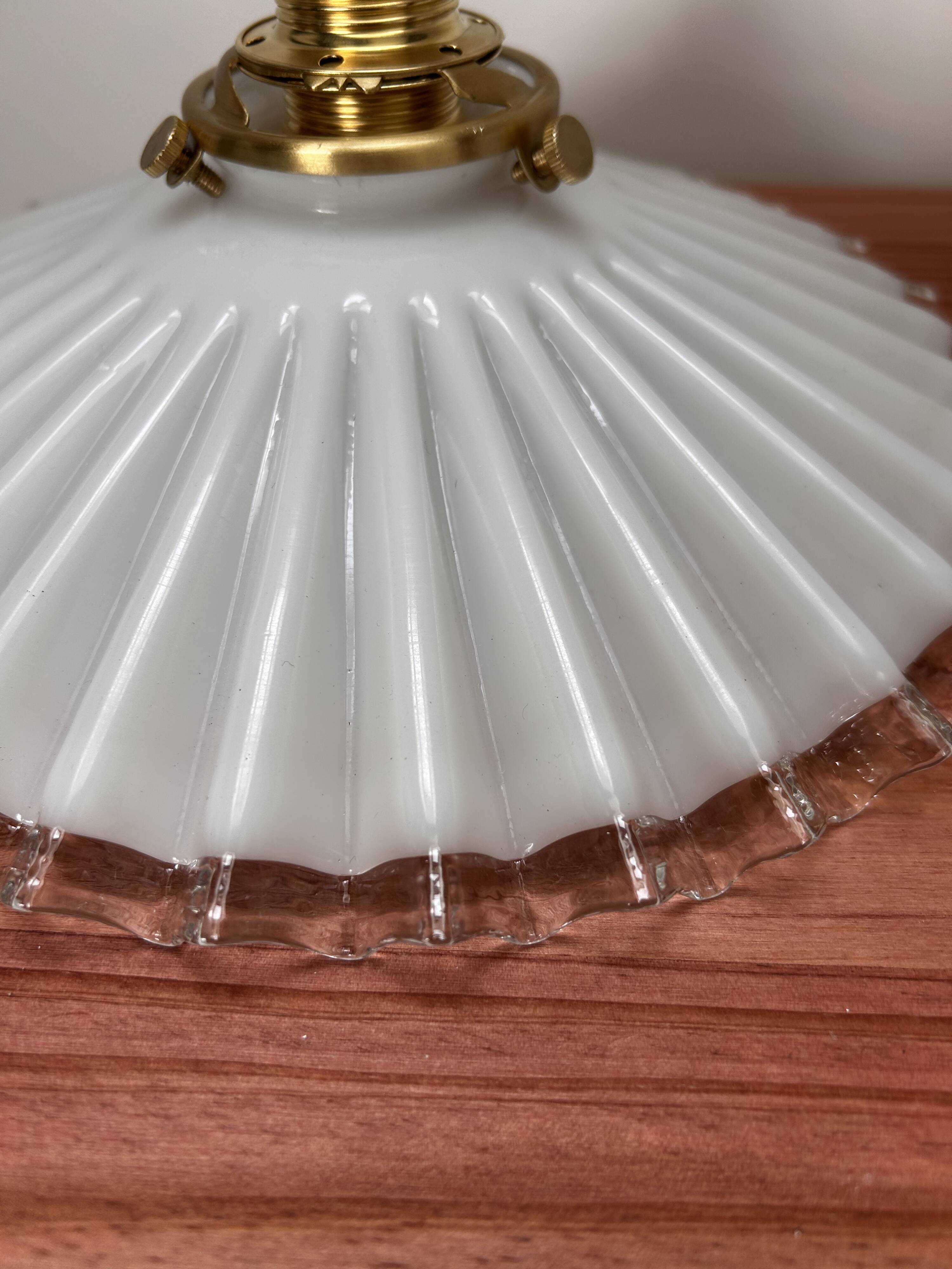 Two wall sconces in serrated white opaline