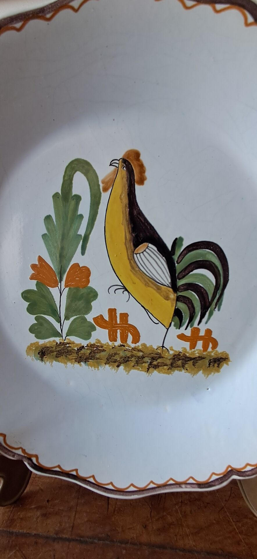 Decorative plate in the 18th-century style. Decoration of a stylised rooster.