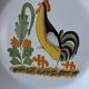 Decorative plate in the 18th-century style. Decoration of a stylised rooster.