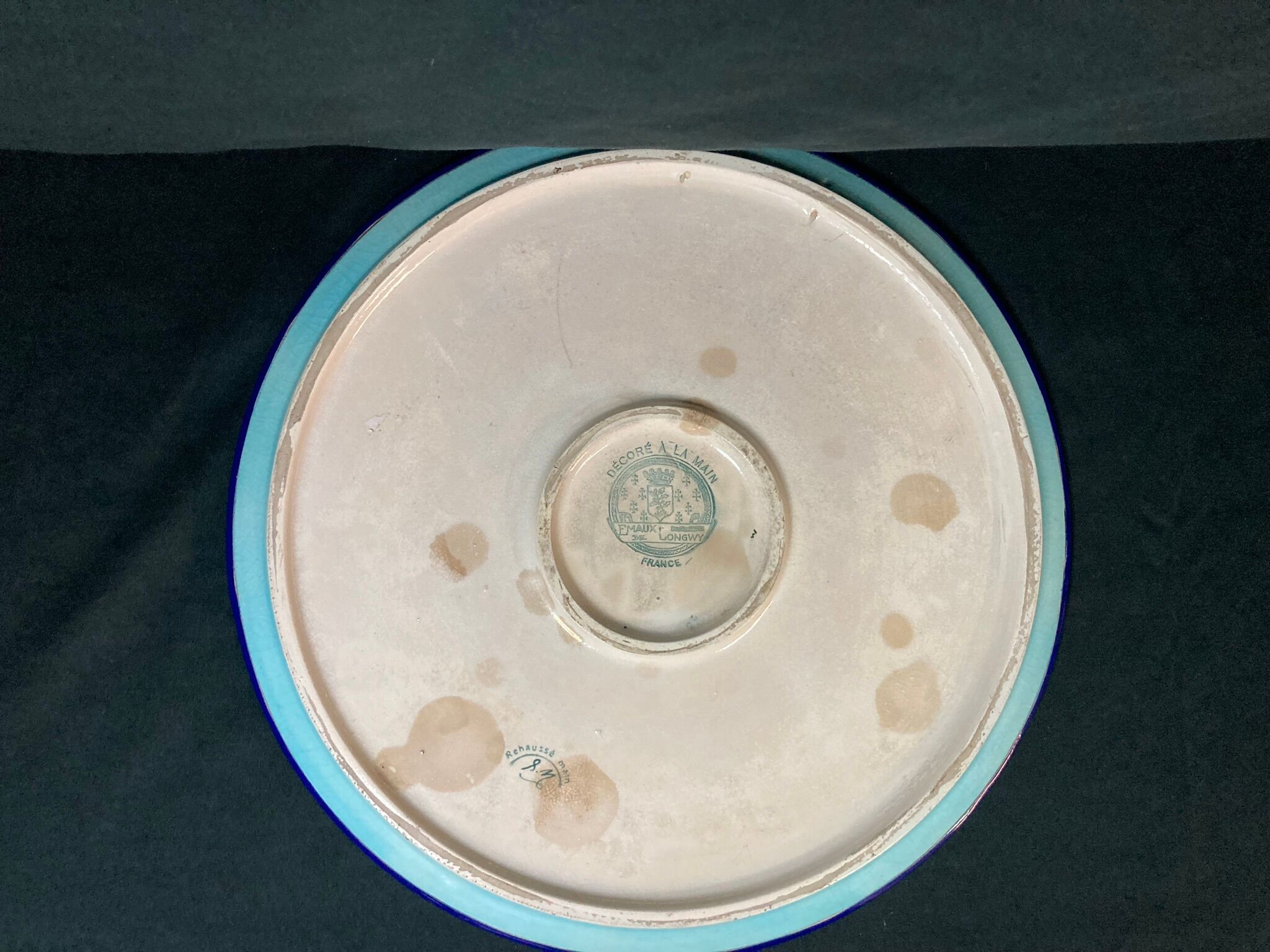 Round polychrome enamel dish with bird decoration circa 1900
