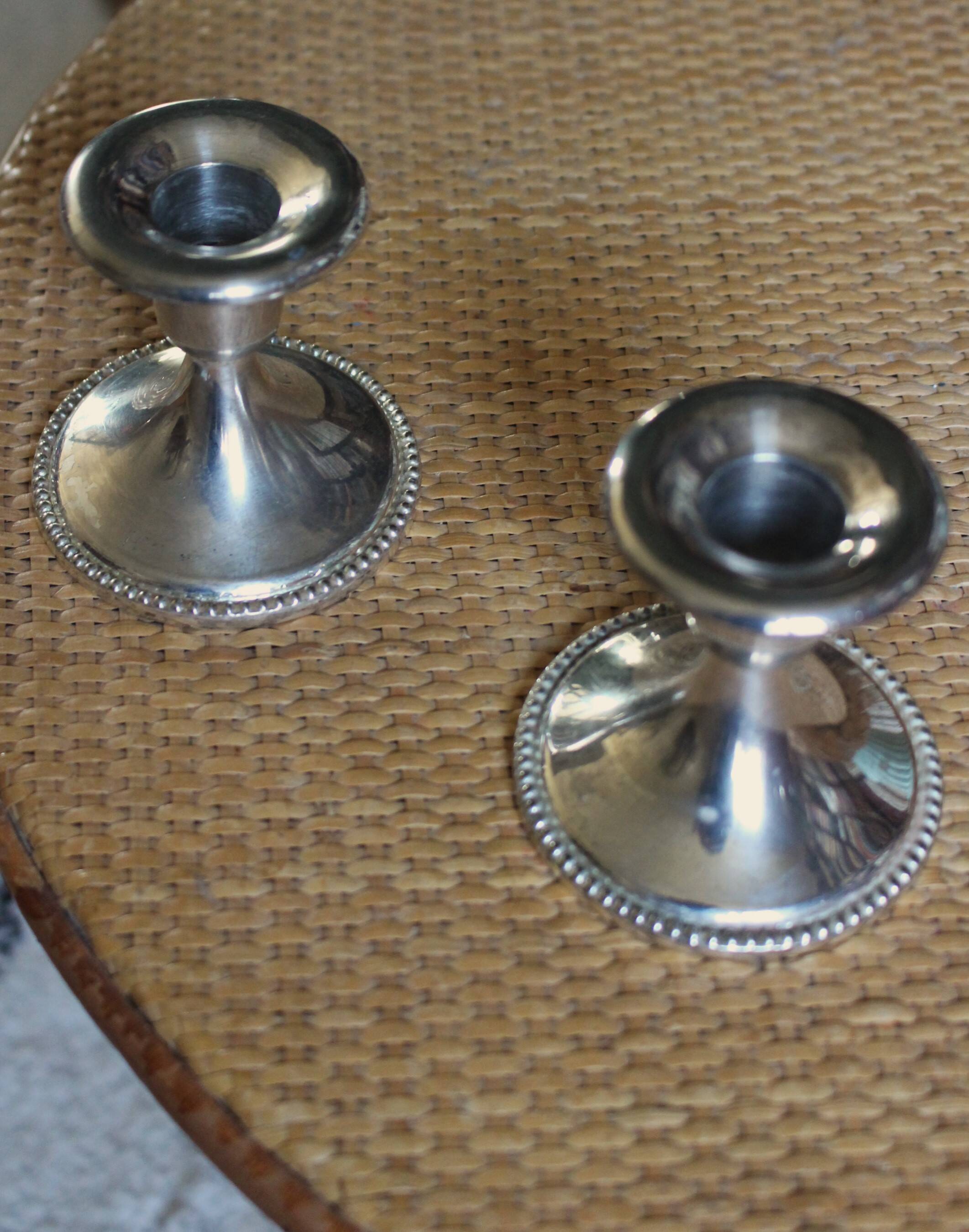 Pair of chrome metal candlesticks