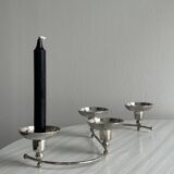 Shiny stainless steel candlestick holder