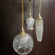 Suspension with three cut glass globes and a diamond tip.