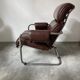 Midcentury tubular chromed chairs with leather cushions