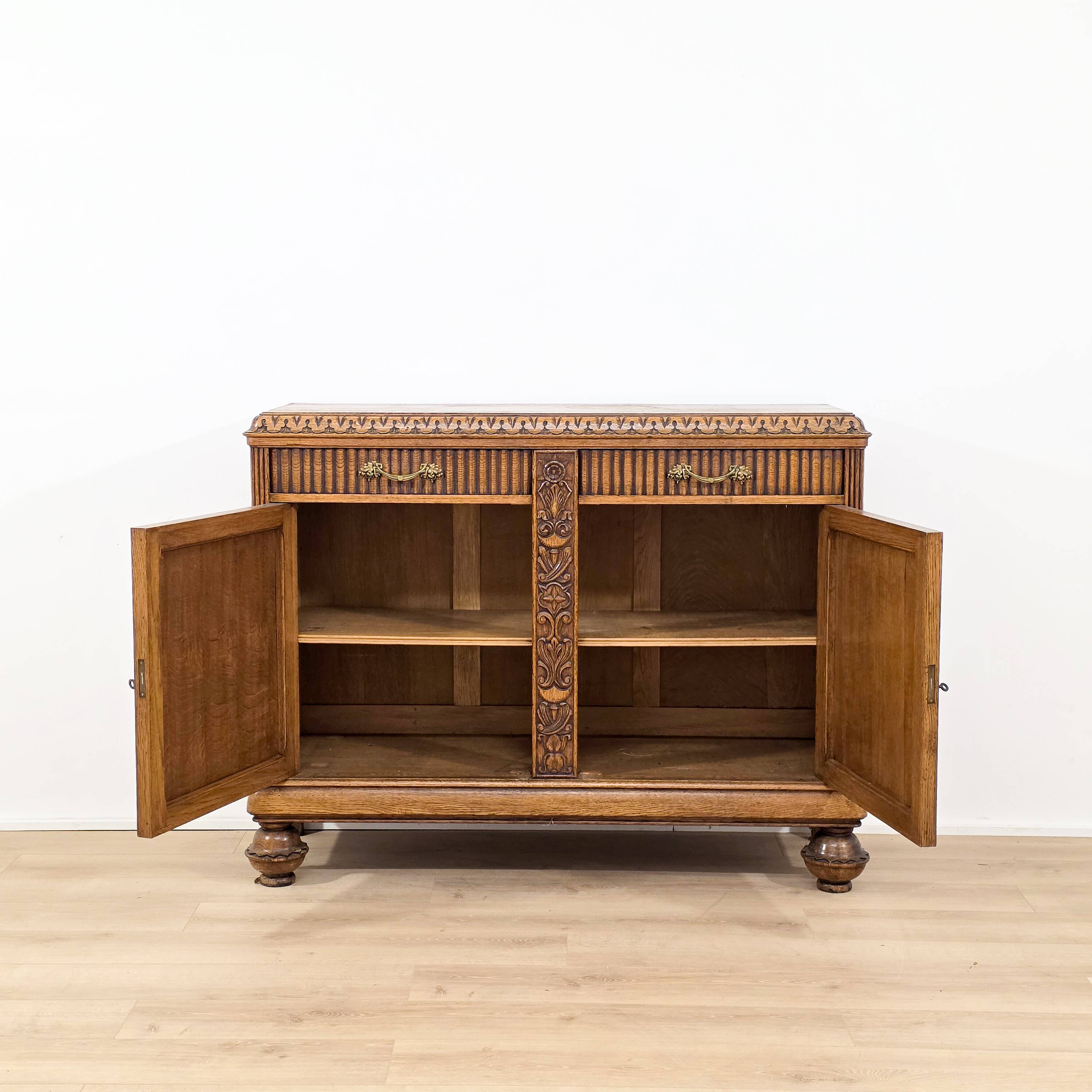 Elegant carved oak sideboard in Renaissance style from the 1930s