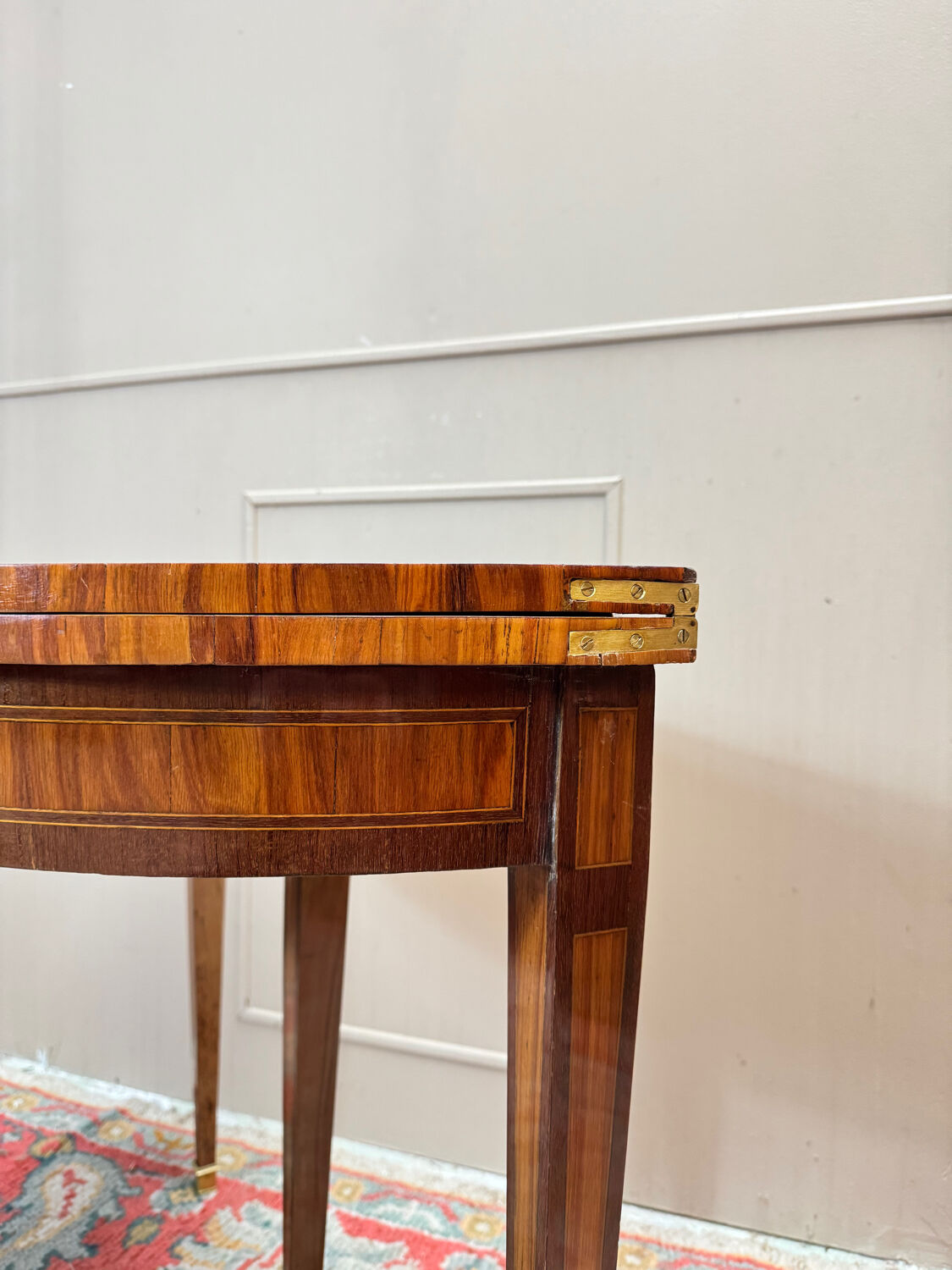 Half-moon game table in marquetry from the Louis XVI period, 18th century.