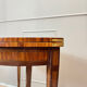Half-moon game table in marquetry from the Louis XVI period, 18th century.