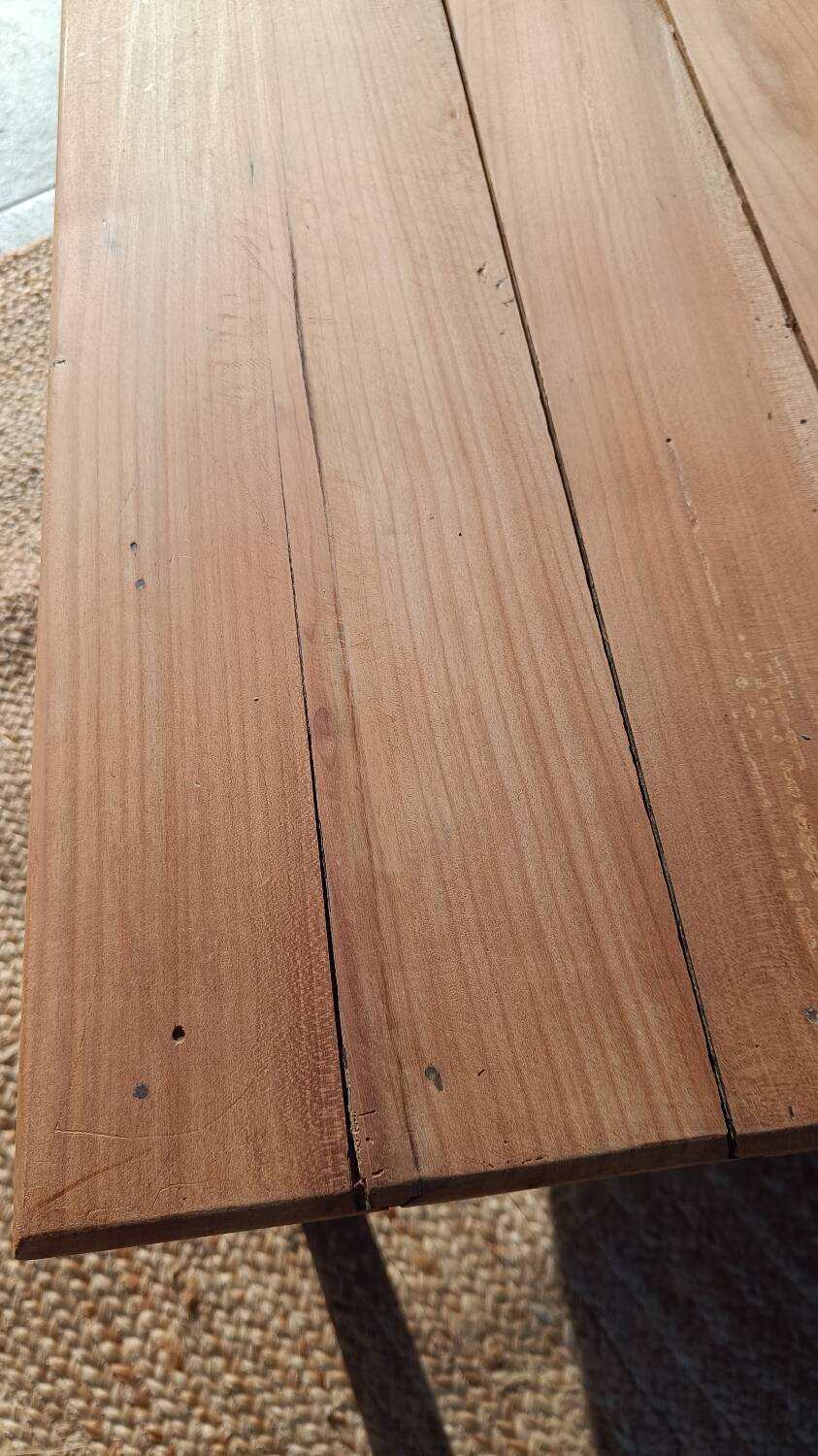 Low farmhouse table in raw wood