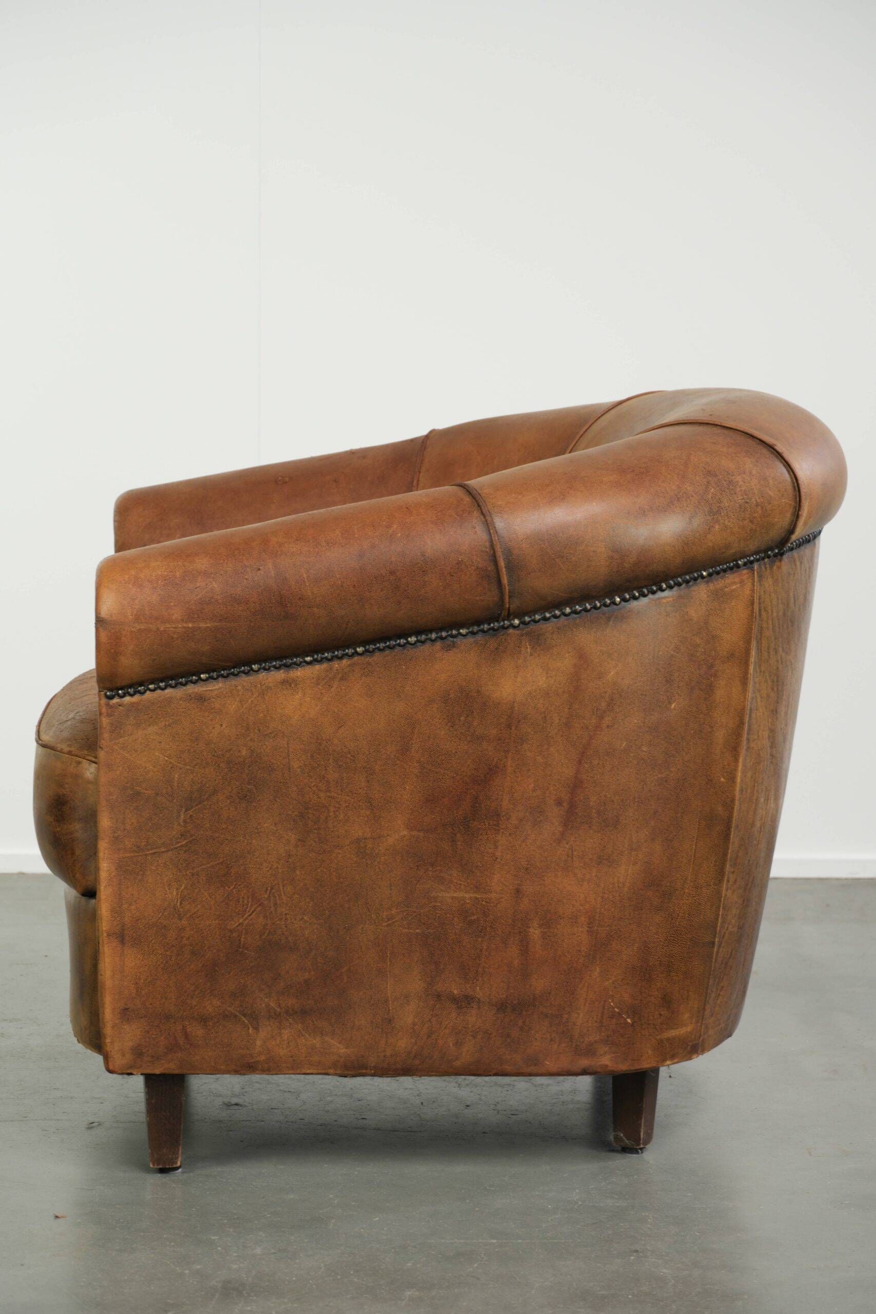 Vintage sheepskin clubchair in a beautiful cognac colour with a sturdy look