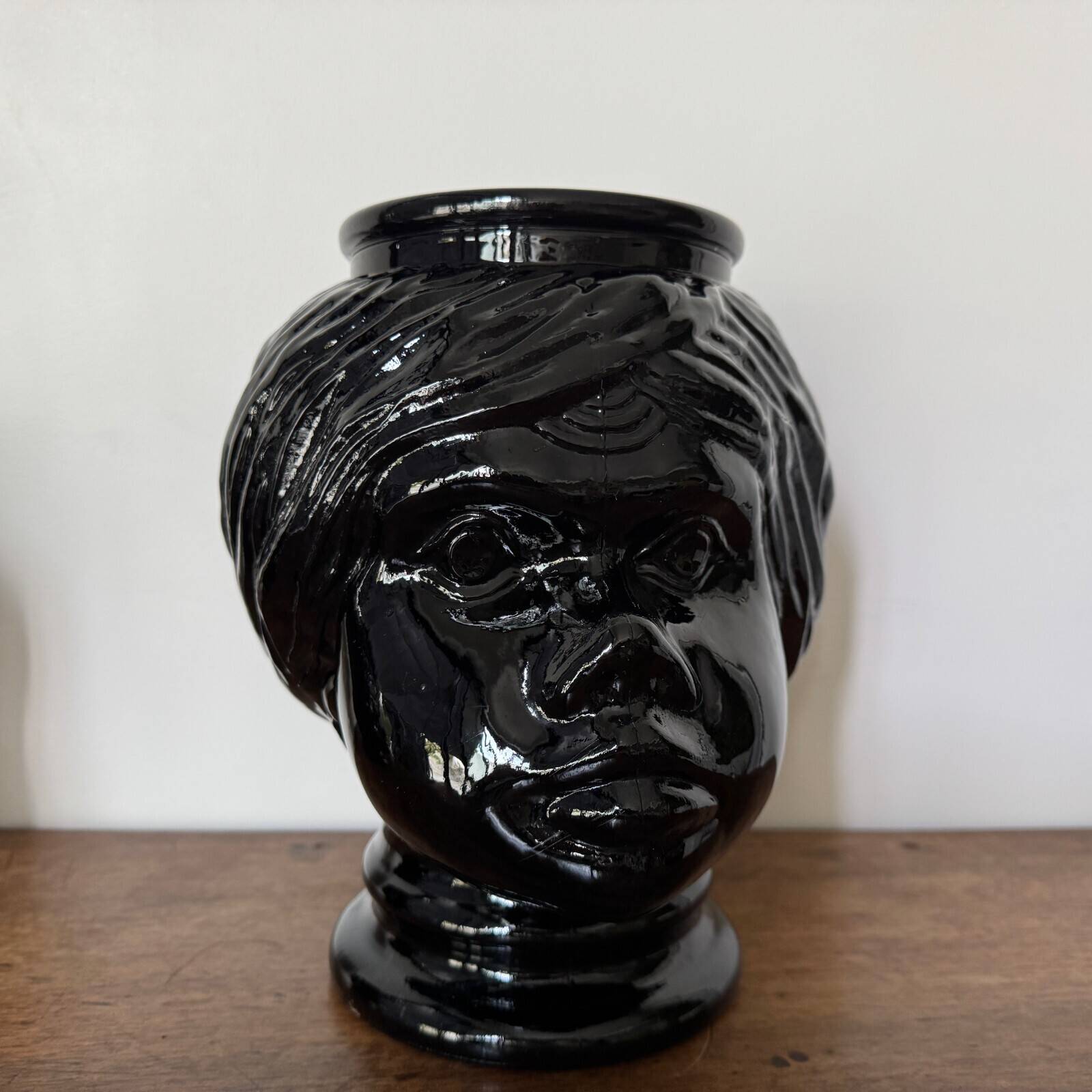 2 glass heads representing Moors