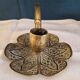 Brass candle holder.