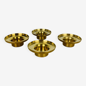 4 golden brass candle holders
