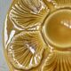 Lot of 12 shell-shaped plates, Barbotine, 1950s.