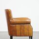 Cognac-colored sheep leather armchair finished with decorative nails