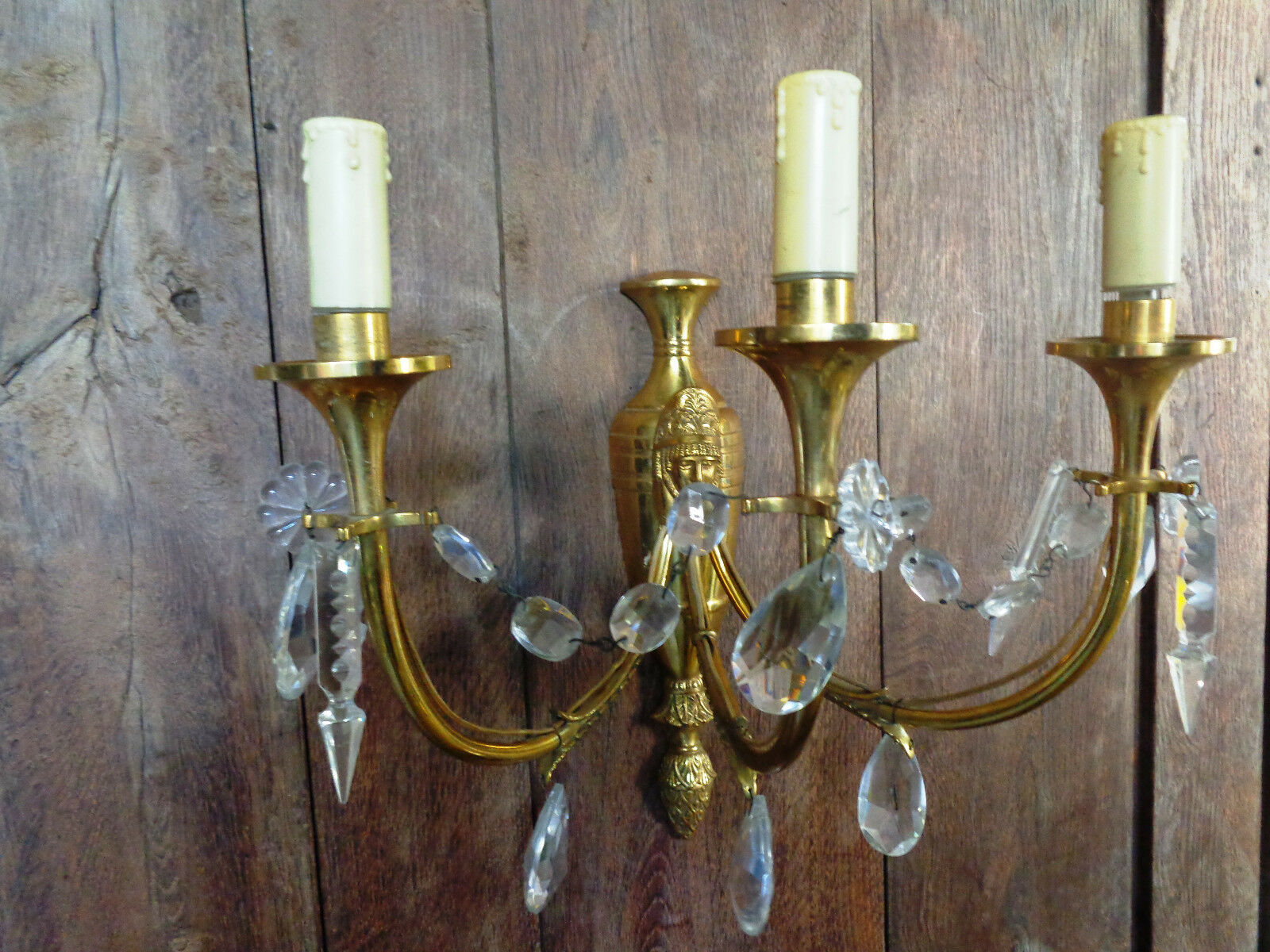 Ancient wall lamp in gilded brass with stamps