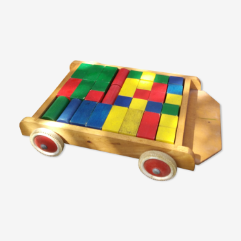 Wooden pull cart with its shapes to build