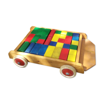 Wooden pull cart with its shapes to build