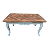 Louis XV style walnut table with a natural wood top.