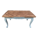 Louis XV style walnut table with a natural wood top.