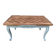 Louis XV style walnut table with a natural wood top.