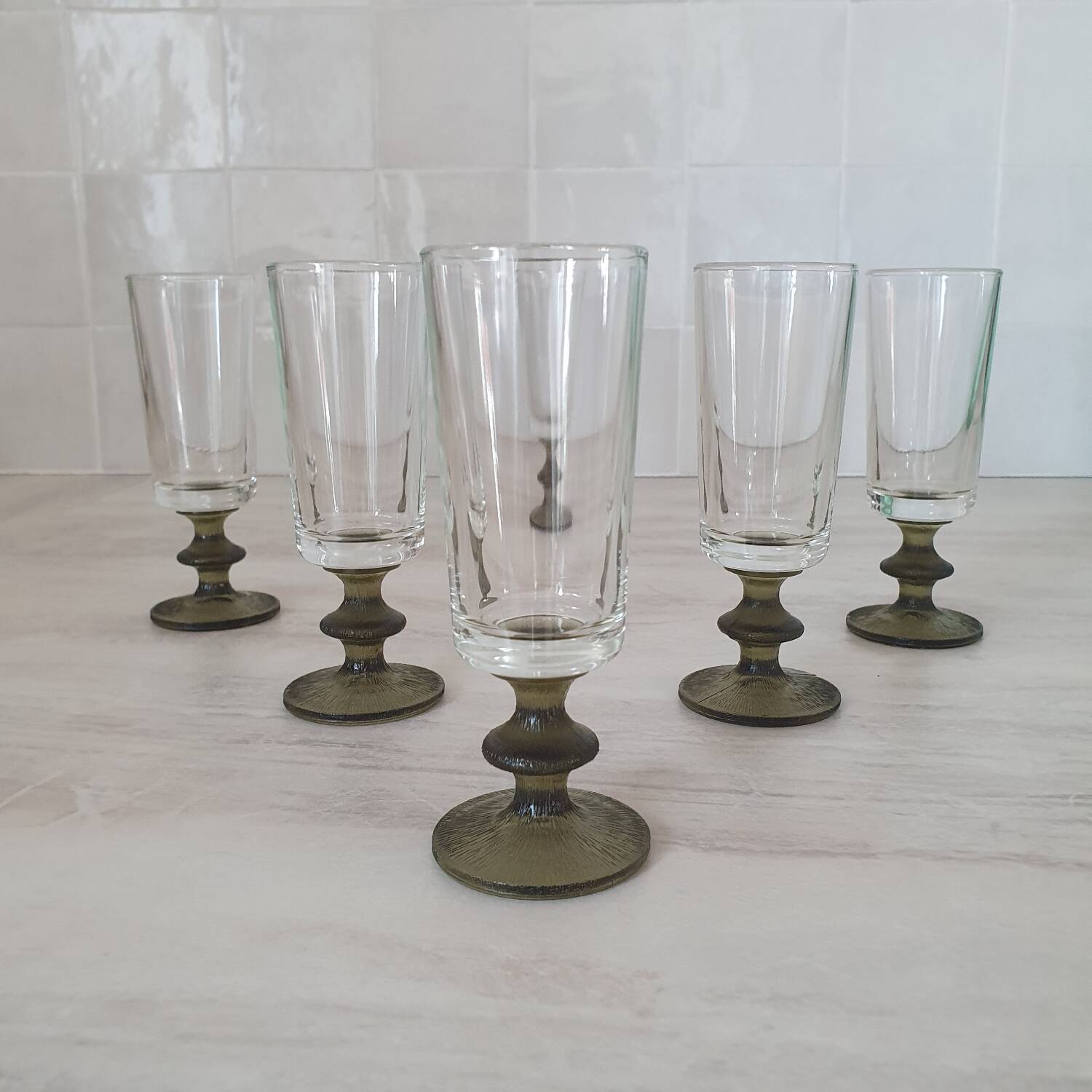 6 small green foot flutes in the Timo Sarpaneva style