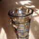 Large brown Art Deco vase with cut facets.