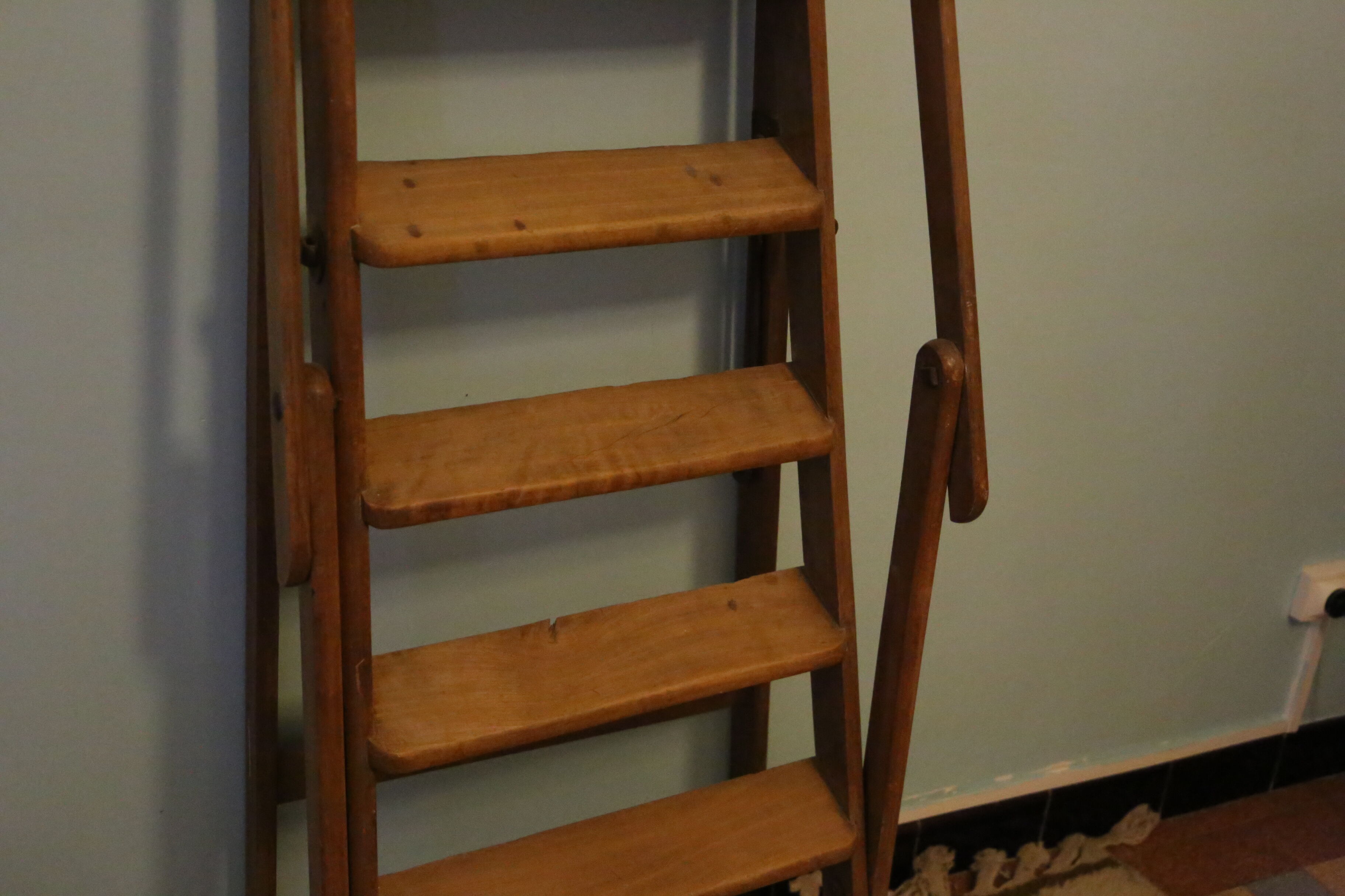 Old wooden stepladder with bodyguards