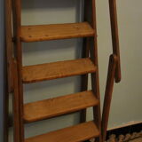 Old wooden stepladder with bodyguards
